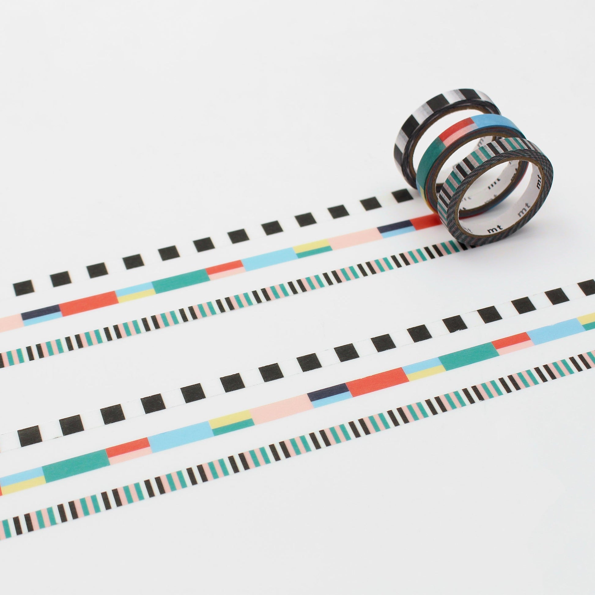 MT Slim × Papier Tigre Washi Tape – Rubans showing a 3-roll set of colorful slim washi tapes with geometric ribbon patterns in red, blue, green, and black stripes.